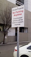 Calgary parking lot sign on post